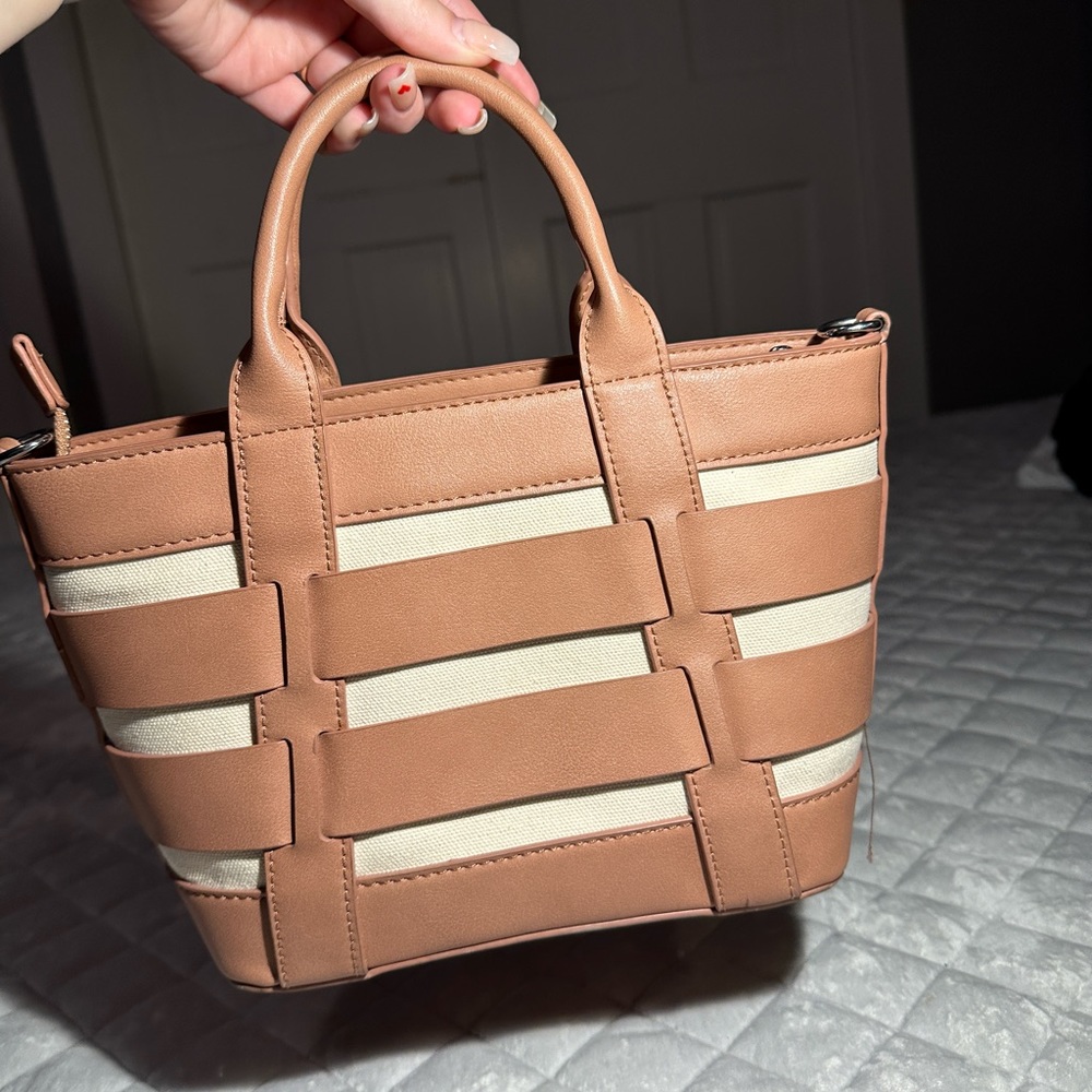 Caged canvas cream and pink Miztique hand purse.